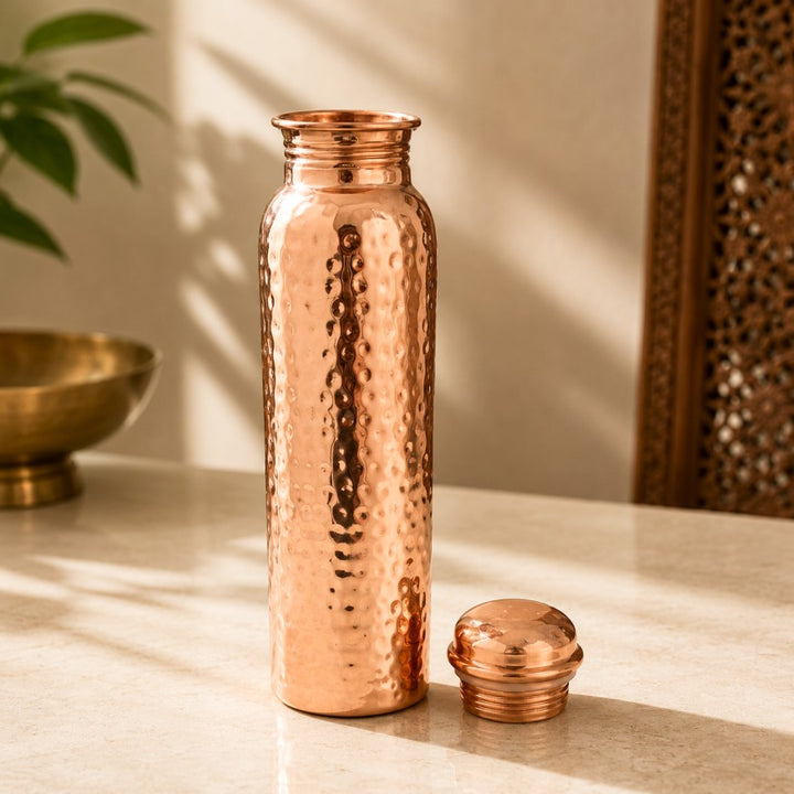 Handcrafted hammered pure copper water bottle with leakproof copper screw cap, made in India by Pitalya