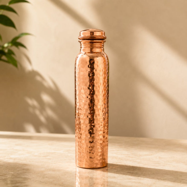 Handcrafted hammered pure copper water bottle with leakproof copper screw cap, made in India by Pitalya