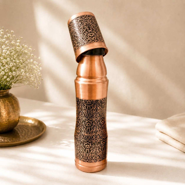 Handcrafted Pure Copper Water Bottle with Intricate Engraved Pattern and Matching Copper Tumbler
