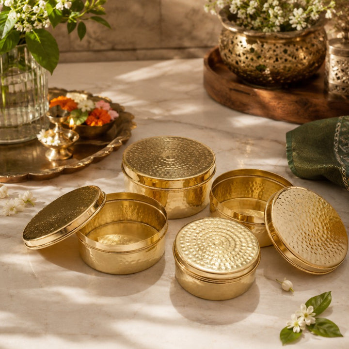 Handcrafted brass ladoo box with lid for storing and serving sweets